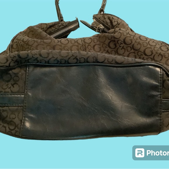 Guess Handbag, front pocket snaps shut, Inside has 1 zipper & 3 slide pockets. - Picture 7 of 8